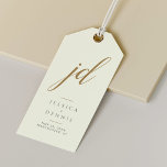 Modern Minimal Elegant Script Monogram Wedding Gift Tags<br><div class="desc">Modern Minimal Elegant Calligraphy Script Monogram Wedding Gift Tags Add a touch of elegance to your wedding favours with these stunning, modern, minimalist, and elegant calligraphy script monogram gift tags. Crafted in classic ivory, Storm Dust and gold, these tags are the perfect way to personalise your gifts and thank your...</div>