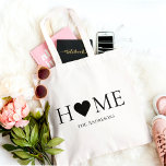 Modern Minimal Home Family Personalised Gift Tote Bag<br><div class="desc">Carry love wherever you go with this Modern Minimal “Home” Heart personalised tote bag — a timeless design that blends elegance and simplicity. Featuring a black heart replacing the “O” in “HOME, ” this chic tote celebrates family, warmth, and minimal design. Customise it with your family name or custom text...</div>
