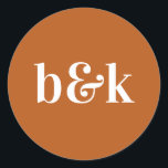 Modern Minimal Monogram Initials Orange Wedding Cl Classic Round Sticker<br><div class="desc">Modern,  minimal,  minimalist wedding design with big bold letters in orange tone colour: Burnt Orange (colour,  font,  text,  size can be changed).  With date and bride and groom monograms (initials).  Stickers / seals for wedding invitation envelopes. Perfect for that young couple for fall/autumn wedding.</div>