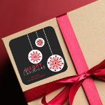 Modern Minimal Nordic Black Red White Christmas Square Sticker<br><div class="desc">Add a touch of holiday magic to your gifts or cards with this customisable Christmas sticker. The design features a trio of red and white snowflakes, each unique in size and pattern, suspended from white strings against a striking black background. The words "Merry Christmas" are elegantly scripted in a combination...</div>