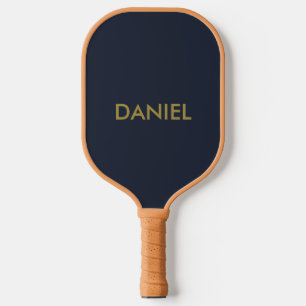 Modern minimalist gold text navy blue pickleball paddle