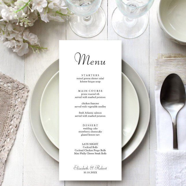 Modern Minimalist White Wedding Menu (Modern Minimalist White Wedding Menu on a beautiful white and silver wedding dinner table.)