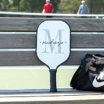 Modern Monogram Minimal Black White Pickleball Paddle<br><div class="desc">Add a touch of modern elegance to your routine with this personalised monogram pickleball paddle design featuring a large initial and name in script. Perfect for yourself or as a thoughtful custom gift. Created by Simply Farmhouse Press.</div>