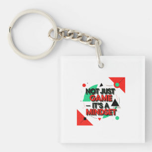 Modern Motivational Graphic with "Not Just Game It Key Ring