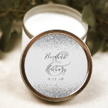 Modern Pale Grey Silver Glitter Edge Wedding Classic Round Sticker<br><div class="desc">This elegant modern wedding sticker features a faux silver glitter design on the top and bottom edge. Easily customise the charcoal grey text on a pale grey background,  with the names of the bride and groom in handwriting calligraphy over a large ampersand.</div>
