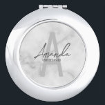 Modern Personalised Bridesmaid's Monogram and Name Compact Mirror<br><div class="desc">Modern Personalised Bridesmaid's Monogram and Name Gifts This design features personalised bridesmaid's name in grey modern handwriting script font style and monogram in light grey modern sans serif font style as background, with wedding details in grey modern sans serif font style, on white marble background. Also perfect for maid of...</div>
