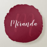 Modern Personalised Monogram and Name Burgundy Red Round Cushion<br><div class="desc">Personalised Monogram and Name Gift featuring personalised name in white modern script font style and monogram in light burgundy red modern script font style as background on burgundy red background. Perfect as holiday gift, family reunion favours, housewarming gift, wedding gift, thank you gift for bridesmaids and gift for any special...</div>
