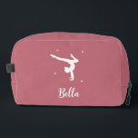 Modern Pink Gymnastics Dance Fitness Travel Dopp Kit<br><div class="desc">This modern pink gymnastics dopp kit features the silhouette of a gymnast alongside your custom name in elegant script typography. Perfect for girls who love tumbling, as a fitness, travel bag or for dance lessons. Personalise it with your name and utilise the editing tool to adjust the font size to...</div>