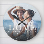 Modern Quote Love Wedding Photo Newlywed Script<br><div class="desc">Custom modern chic photo clock with hand-lettered script and modern typography reading:' Love conquers all ' alongside your custom names and wedding date. Personalise with your favourite photo and information. Great gift for newlyweds,  an anniversary or Valentine's Day!</div>