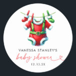 Modern Red Holly Christmas Santa Baby Shower Classic Round Sticker<br><div class="desc">Enhance your holiday baby shower with our Modern Red Holly Christmas Santa Baby Shower Classic Round Sticker. Featuring a festive Santa Claus design on a vibrant red background, this sticker is adorned with holly and winter greenery, adding a cheerful touch to your event. Perfect for sealing envelopes, decorating favour bags,...</div>