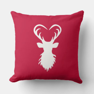 Modern reindeer silhouette on burgundy red cushion