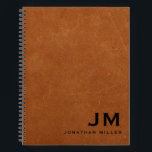 Modern Sable Leather Monogram Initials Name Notebook<br><div class="desc">Modern notebook features a classic black and white colour palette on a sable brown distressed leather background. Custom name presented in the lower right-hand corner with complimentary monogram initials in bold classic block typography. Shown with a custom name and monogram initial on the front in modern typography, this personalised business...</div>