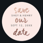 Modern save the date rose gold blush pink classic round sticker<br><div class="desc">A modern save the date sticker that features casual save the date script in rose gold with couples name and date in dark grey on a blush pink background. Perfect for use as an envelope closure or for favours or gift bags. Coordinates with out Modern rose gold save the date...</div>