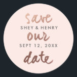Modern save the date rose gold blush pink classic round sticker<br><div class="desc">A modern save the date sticker that features casual save the date script in rose gold with couples name and date in dark grey on a blush pink background. Perfect for use as an envelope closure or for favours or gift bags. Coordinates with out Modern rose gold save the date...</div>
