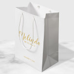 Modern Script Gold Personalised Bridesmaids Medium Gift Bag<br><div class="desc">Modern Script Gold Personalised Bridesmaids Gift Bag featuring personalised bridesmaid's name in gold modern calligraphy font style with title and wedding date in modern sans serif font style on white background. Also perfect for Maid of Honour, Flower Girl, Mother of the Bride, Groomsmen, Best man and more. Please Note: The...</div>