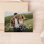 Modern script navy save the date photo card<br><div class="desc">With a single horizontal photo and a modern script written "save the date, " this card is the perfect way to announce your engagement and upcoming wedding to friends and family. The white text is bold and modern but still sophisticated. The customisable text on the front has room for names,...</div>