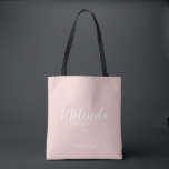 Modern Script Personalised Bridesmaids Tote Bag<br><div class="desc">Modern Script Personalised Bridesmaids Tote Bag
featuring personalised bridesmaid's name in white modern script font style with title and wedding date in modern sans serif font style on blush pink background.

Also perfect for Maid of Honour,  Flower Girl,  Mother of the Bride and more.</div>