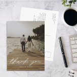Modern Script Photo Wedding Thank You Postcard<br><div class="desc">This Wedding Thank You Postcard is a simple way to thank your wedding guests for celebrating with you. This design features a modern calligraphy script font, your photo of choice on the front and your personal message on the back. The colour of "Thank you" can be changed to fit your...</div>