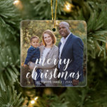 Modern Simple Photo Elegant Christmas Ceramic Ornament<br><div class="desc">Add a memory to your tree with this modern keepsake ceramic ornament featuring a simple design with the greeting, "merry christmas" in an elegant white script typography along with your family name and year over your favourite photo. Add the same photo to both sides or a different one on each...</div>