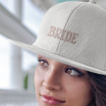 Modern Simple Pink Bride Typography Engagement<br><div class="desc">This baseball cap features a sleek and modern design with pink typography that adds a stylish flair. The embroidered details give it a high-quality finish, making it an elegant choice for any occasion. Whether you're celebrating your engagement or enjoying your honeymoon, this cap will make you feel like the centre...</div>