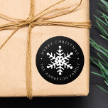 Modern Snowflake Black Holiday Sticker<br><div class="desc">Add a personalised touch to your holiday gifts and envelopes with these elegant snowflake stickers. The custom holiday stickers feature a white hand-drawn snowflake in the middle with your custom greeting and family name in white lettering on a black background. The modern holiday stickers are perfect to add to use...</div>