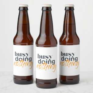 Modern, trendy, urban design of Busy Doing Nothing Beer Bottle Label