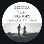 Modern White & Black Script Couple Photo Wedding Classic Round Sticker<br><div class="desc">A beautiful white and black calligraphy script design showcasing the couple's photo. A modern wedding couple photo design with simple minimalistic elements. An ideal wedding modern sticker design for anyone who loves script calligraphy, black and white designs and photo picture wedding stationery. Matching wedding invitations and other stationery items are...</div>