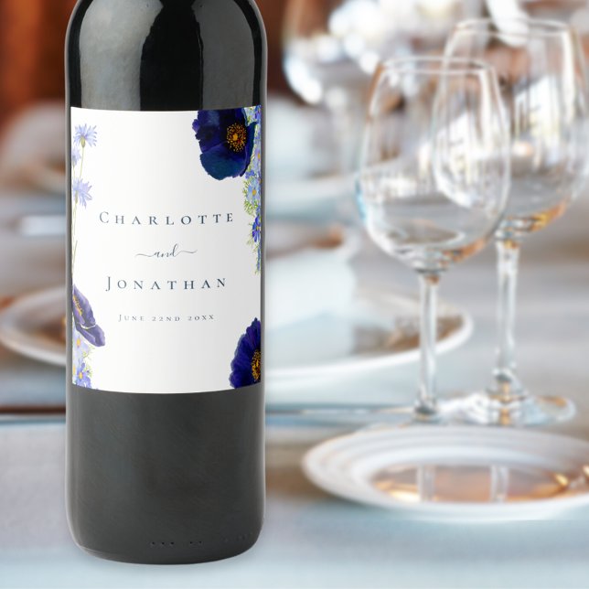 Modern Wildflower Blue Wedding Wine Label (Elegant wildflower blue floral wedding wine labels with bride and groom names and date in typography)