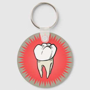 Molar freshly extracted on a red starburst key ring