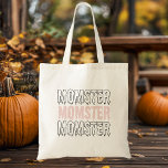 Momster Pink Halloween Cute & Spooky!" Tote Bag<br><div class="desc">Carry your Halloween essentials in style with our "Momster" Pink Halloween Tote Bag! Perfect for moms who love to embrace the spooky season with a touch of humour, this tote bag features the playful "Momster" design in bold, spooky lettering on a vibrant pink background. Whether you're trick-or-treating with the kids,...</div>