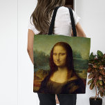 Mona Lisa | Leonardo da Vinci Tote Bag<br><div class="desc">Mona Lisa (1503-1506) by Italian Renaissance artist Leonardo da Vinci. The original work is oil on poplar wood panel. This famous painting is thought to be a portrait of Lisa Gherardini, and has been acclaimed as "the best known, the most visited, the most written about, the most sung about, the...</div>