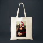 Mona Lisa Santa Hat Christmas Tote Bag<br><div class="desc">* Celebrate the Christmas Season with Mona Lisa! * Tote Bags are available in several size, colour and style options. * Use for shopping, books, weekending or road snacks. * Choose font style, colour, size and placement of text, or remove text option. * Both sides of the bag can be...</div>