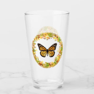 Monarch butterfly in frame of leaves glass