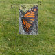 Monarch butterfly on evergreens
