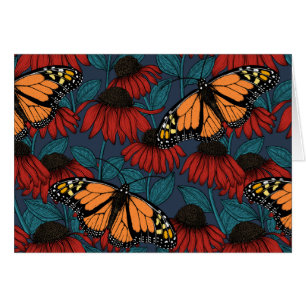 Monarch butterfly on red coneflowers