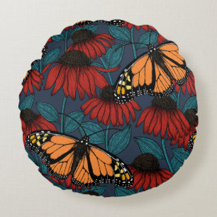 Monarch butterfly on red coneflowers round cushion