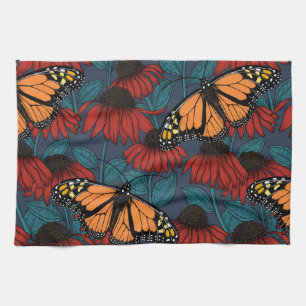 Monarch butterfly on red coneflowers tea towel