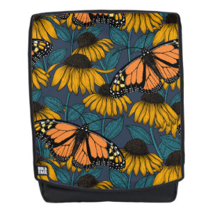 Monarch butterfly on yellow coneflowers backpack