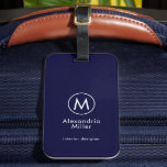 Monogram Elegant Minimal Navy Blue Luggage Tag<br><div class="desc">A minimalist monogram design with large typography initial in a stylish elegant font with your name and title or custom text below on a simple navy blue background. A perfect custom gift or accessory.</div>