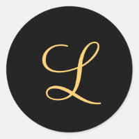 Monogram , gold coloured initial L on black,