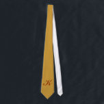 Monogram Gold Tie<br><div class="desc">No one will look better than you when you wear this tie with your initial on it. Add the initial that you want in the field provided. You can add one or more initials or a name, the choice is yours. The type style, size and colour can also be changed....</div>