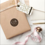 Monogram Initials on Chocolate Brown Wedding Classic Round Sticker<br><div class="desc">These custom wedding sticker labels feature a simple and modern design. Sample monogram initials are placed in the centre,  followed by a wedding date and location. The background features a dark chocolate brown colour.</div>