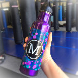 Monogram purple turquoise blue confetti dots teal 710 ml water bottle<br><div class="desc">Sparkly turquoise blue, purple, pink, and green confetti dots on a dark teal background adorn this chic, modern monogramed stainless steel water bottle. Add a sense of style to your workout. Makes a fun statement every time you use it. Customise the bottle colour with one of 10 colours or leave...</div>