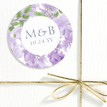Monogram Purple Watercolor Wisteria Floral Wedding Classic Round Sticker<br><div class="desc">Monogram Purple Watercolor Wisteria Floral Wedding Stickers features elegant watercolor wisteria flowers in soft lavender and purple with green leaves on a white background with your monogram and wedding date below. Designed for you by Evco Studio www.zazzle.com/store/evcostudio</div>