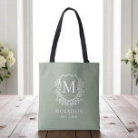 Monogram Sage Green Crest Botanical Wedding  Tote Bag<br><div class="desc">Bring a fresh, elegant touch to your celebration with our Monogram Sage Green Crest Botanical Wedding Tote Bag. Featuring a soft sage green background, a refined botanical crest, and your personalised monogram, this tote perfectly combines timeless charm with modern style. Ideal for wedding welcome bags, bridal party gifts, or guest...</div>