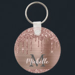 Monogrammed Rose Gold Glitter Drips on Pink Metal Key Ring<br><div class="desc">Modern, girly rose gold glitter drips name and monogrammed keychain.This design features blush pink rose gold glitter sparkle drips on pink brushed metal background with custom personalised monogram initial and first name text template. Perfect feminine gift. Please note, this design is printed photo effect. If you need help or matching...</div>