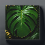Monstera Leaves Gold Jungle Glamour Plaque<br><div class="desc">Indulge in sophisticated jungle opulence with this stunning high-contrast botanical! Oversized, glossy Monstera leaves gleam in deep emerald green with luxurious metallic-gold veins and delicate gold outlining, set against a dramatic inky black backdrop. Layered palm fronds add depth and richness, creating an instantly glamorous, modern-tropical statement that exudes elegance and...</div>