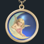 MOON ANGEL GOLD PLATED NECKLACE<br><div class="desc">Whimsical cute blonde haired , blue eyed romantic angel hanging on the Moon with a bright 3D Blue Sapphire gem stone.</div>