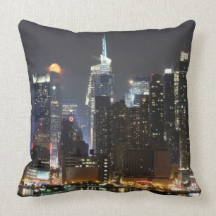 Moon rises over midtown New York. Cushion