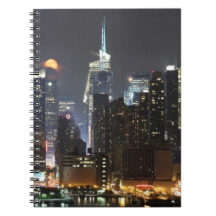Moon rises over midtown New York. Spiral Notebook